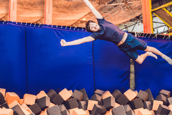 Man jumping into a foam pit